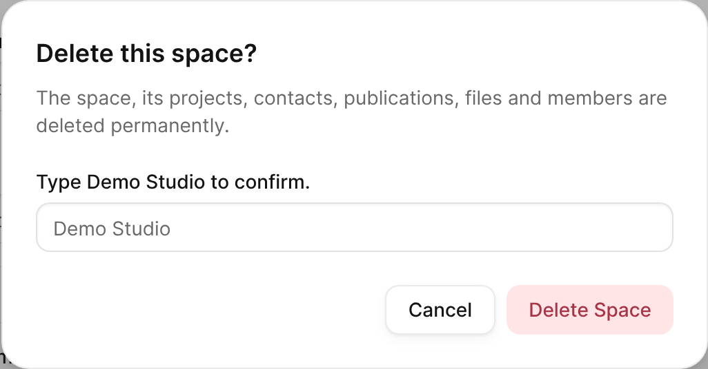The Delete this space? dialog, which asks you to type the space name and hold the button.
